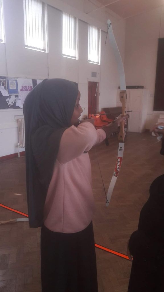 A Girl doing archery on Radiant Rubies 2017 Events